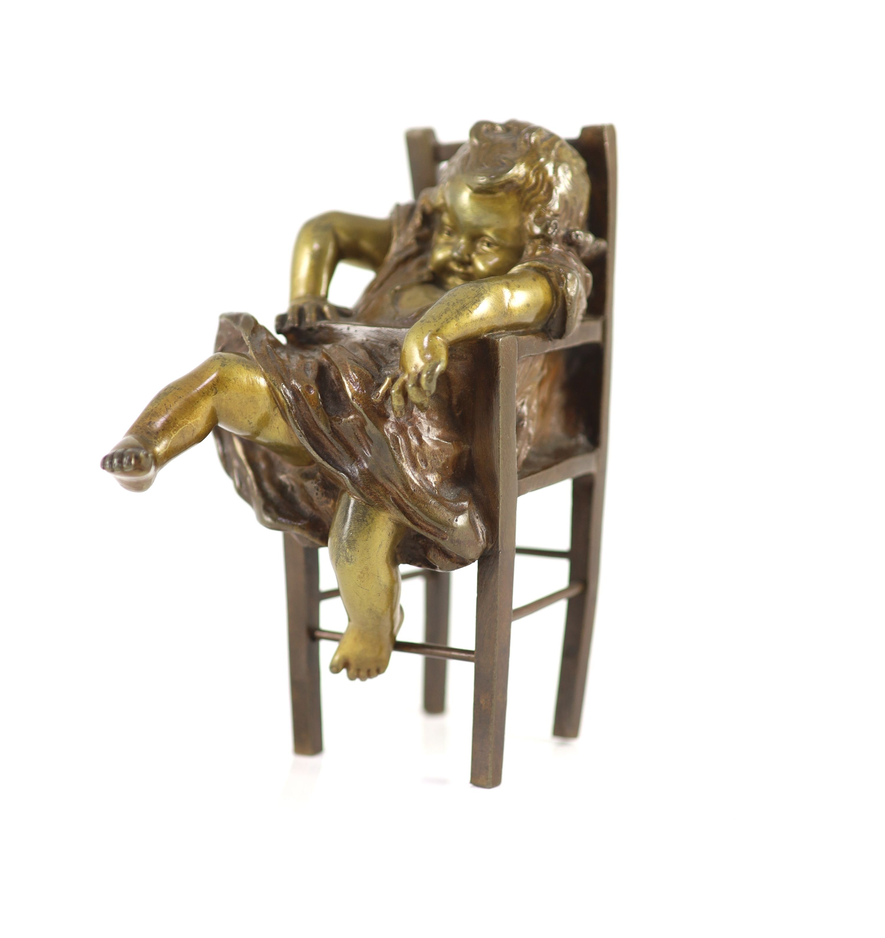 After Joan Clarà (1875 - 1958). A pair of bronze models of girls playing on chairs, height 15.5cm